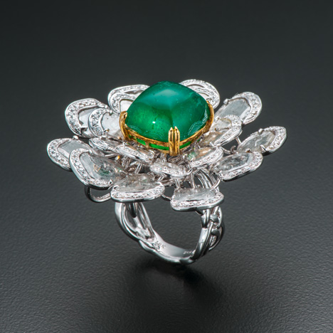 A 12.09 ct sugar-loaf cabochon emerald