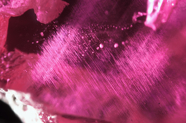 Silk and rounded crystal inclusions