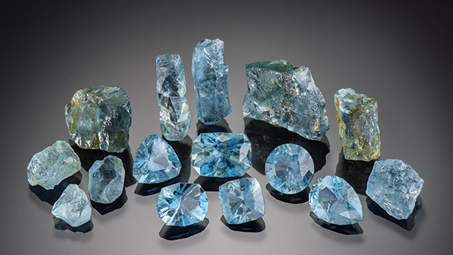 Rough and faceted Nigerian aquamarine.