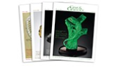A collection of magazine covers featuring a green snake sculpture and various artistic designs.