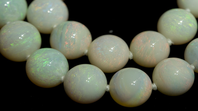 Light-colored Opal Beads. These light-colored opal beads are milky in appearance and have numerous dead spots with no play-of-color. Courtesy Cody Opal