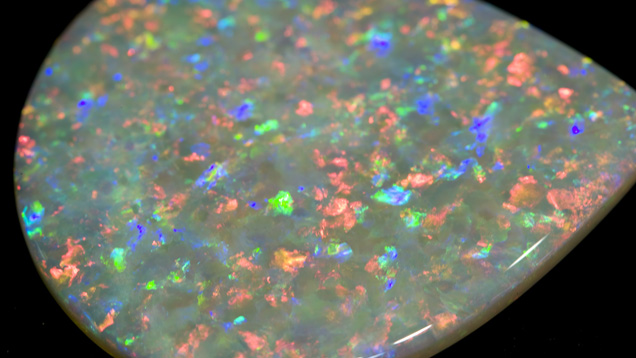 Fine-quality Light Opal. This fine-quality light opal is from Mintabie, South Australia. Almost all of its spectral colors are visible from a variety of viewing angles. - Courtesy Cody Opal