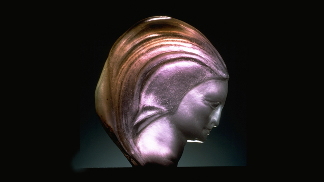 376.85-carat Tourmaline. This 376.85-carat tourmaline was carved by O. Hansen, using the colors of the tourmaline as part of the design. - Chip Clark, courtesy Smithsonian Institution, National Museum of Natural History