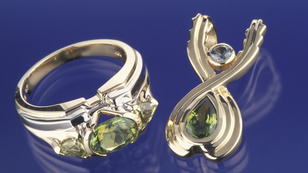Healing Sisters. These peridots from Peridot Mesa in the San Carlos Apache Nation, Arizona, are set in a jewelry style called "Healing Sisters.” - Courtesy Apache Gems