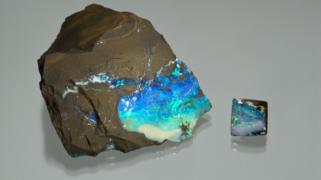 3.47 Carat Boulder Opal Tablet. The rough specimen is a thin seam of boulder opal on sandstone host rock. The 3.47-carat boulder opal tablet was cut from a similar piece of rough.